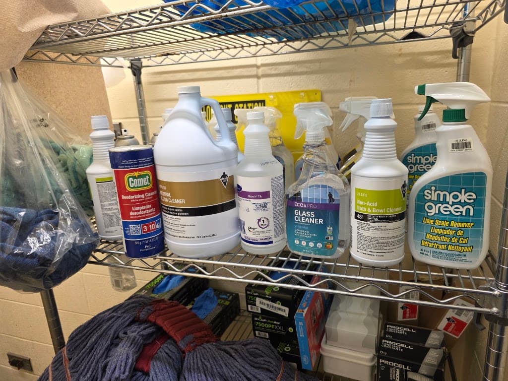 Shelf stocked with premium professional cleaning products and supplies